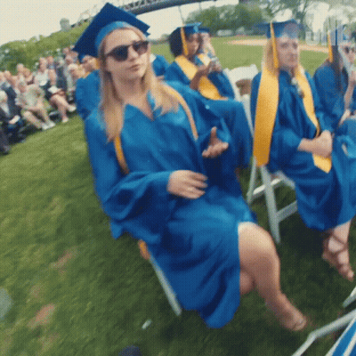 Woman In Blue Graduation Cap And Gown GIF