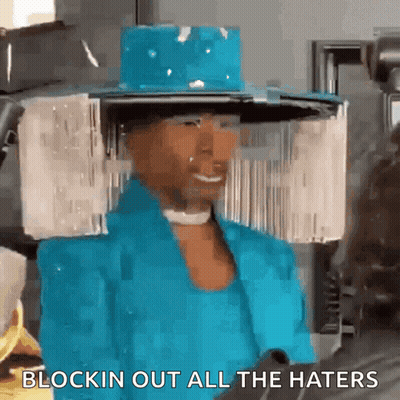 Woman In Blue Hat And Jacket Saying Blockin Out All The Haters GIF