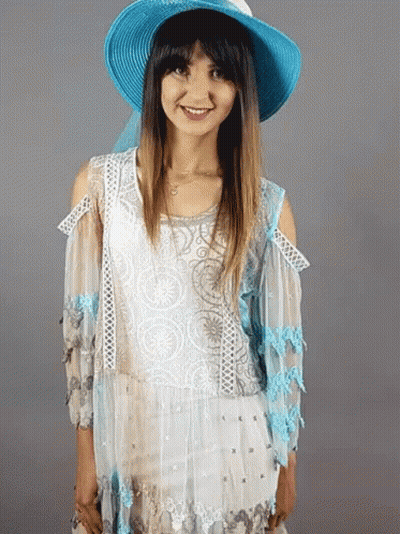 Woman In Blue Hat And White Top Smiling GIF