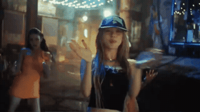 Woman In Blue Hat Dancing In Dark Room GIF