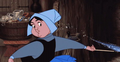 Woman In Blue Hat Holding Magic Wand GIF