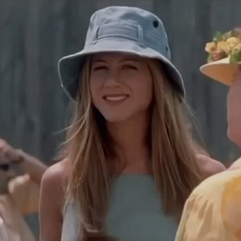 Woman In Blue Hat Smiling At Camera GIF