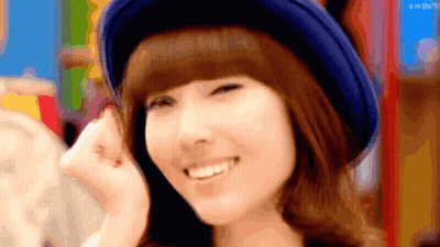 Woman In Blue Hat Smiling With GM Letters GIF