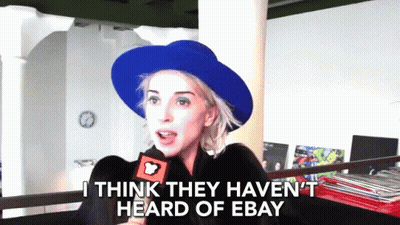 Woman In Blue Hat Talking Into Microphone GIF