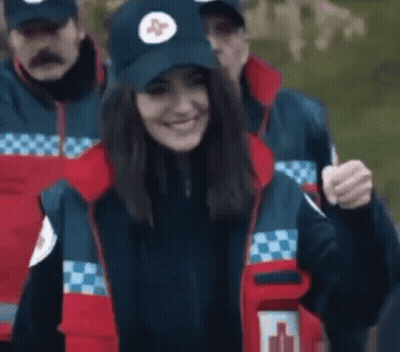 Woman In Blue Hat With Red Cross GIF
