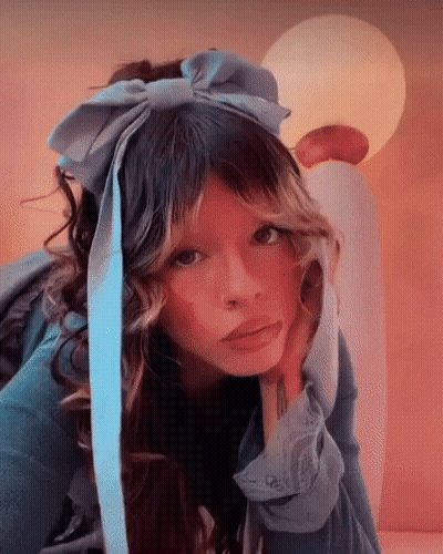 Woman In Blue Headband With Bow GIF