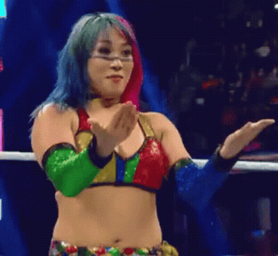 Woman In Blue Holding Wrestling Championship Belt GIF