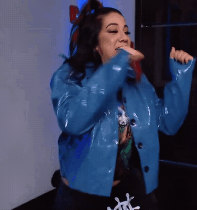 Woman In Blue Jacket And Black T-Shirt With Letter L GIF