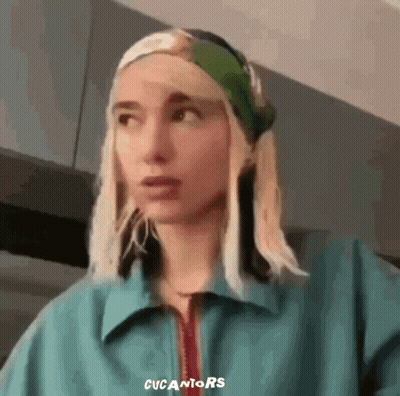 Woman In Blue Jacket And Green Headband GIF