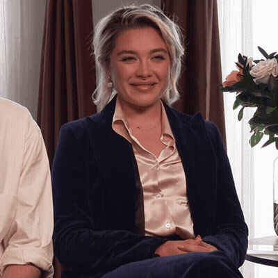 Woman In Blue Jacket And Pink Shirt Smiling GIF