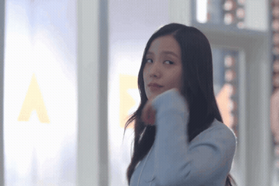 Woman In Blue Jacket At Window GIF