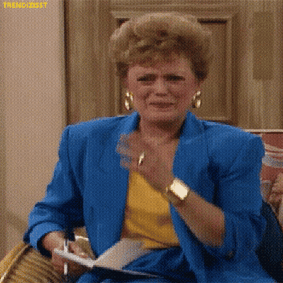 Woman In Blue Jacket Crying Holding Pen And Paper GIF
