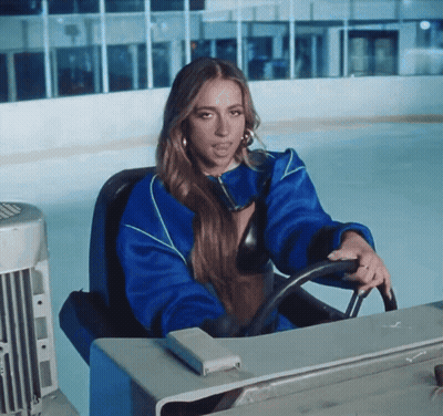 Woman In Blue Jacket Driving On Ice GIF