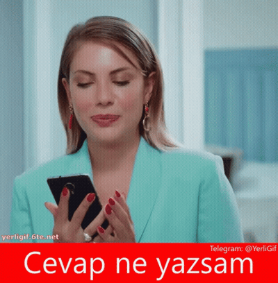 Woman In Blue Jacket Holding Phone Saying Cevap Ne Yazsam GIF