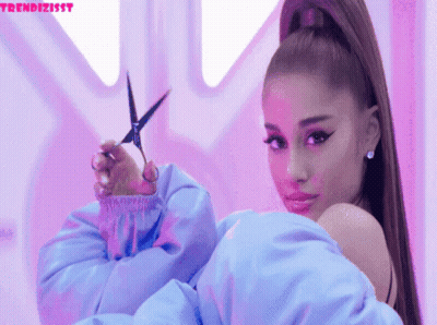 Woman In Blue Jacket Holding Scissors GIF
