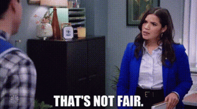 Woman In Blue Jacket Saying That's Not Fair Beside Man GIF