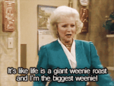 Woman In Blue Jacket Says Life Is A Giant Weenie Roast GIF