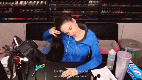 Woman In Blue Jacket Sitting At Desk With Chips GIF