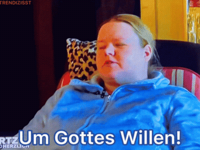 Woman In Blue Jacket Sitting With Um Gottes Willen GIF