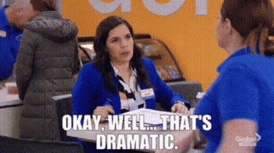 Woman In Blue Jacket Talking To Another At Counter GIF