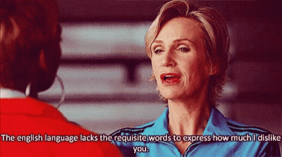 Woman In Blue Jacket Talking To Woman In Red Jacket GIF