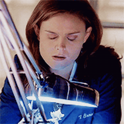 Woman In Blue Jacket With Number 7 GIF