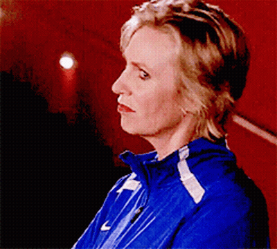 Woman In Blue Jacket With White Stripes GIF