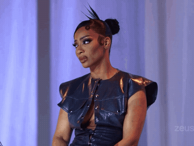 Woman In Blue Leather Top With Zeus GIF