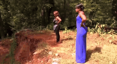Woman In Blue Next To Woman In Black GIF