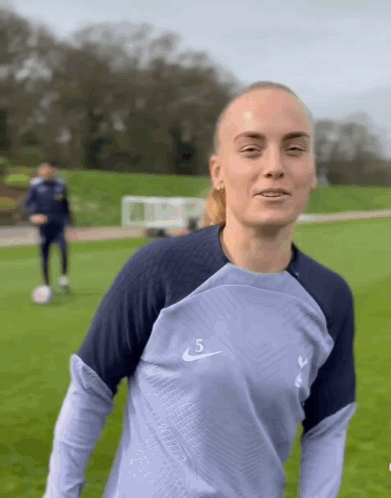 Woman In Blue Nike Shirt Number 5 GIF