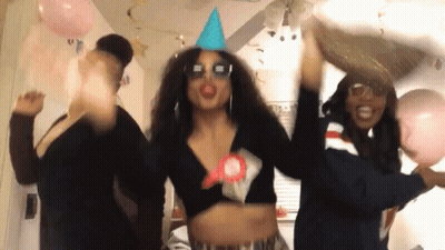 Woman In Blue Party Hat And Sunglasses Dancing With Two Women GIF