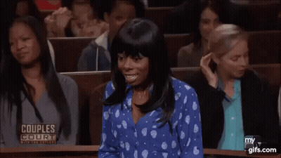 Woman In Blue Polka Dot Shirt In Courtroom GIF