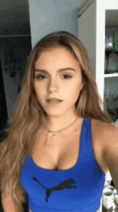 Woman In Blue Puma Tank Top Taking Selfie GIF