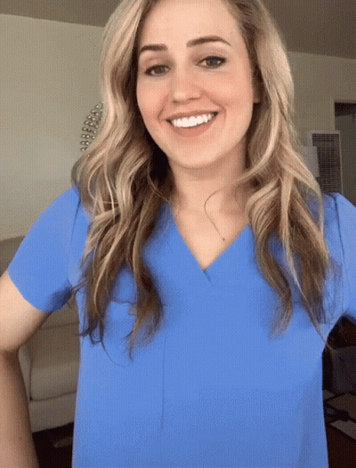 Woman In Blue Scrub Top Smiling GIF