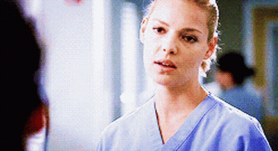 Woman In Blue Scrub Top Talking GIF