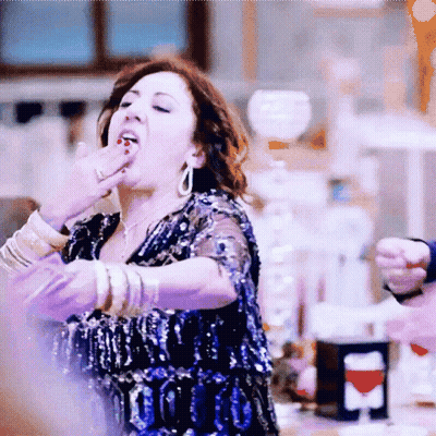 Woman In Blue Sequin Dress Covering Mouth GIF