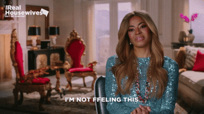 Woman In Blue Sequined Top Saying I'm Not Feelin' This GIF
