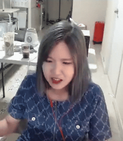 Woman In Blue Shirt And Headphones GIF