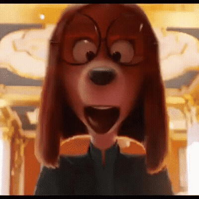 Woman In Blue Shirt And Necklace In Front Of Castle GIF