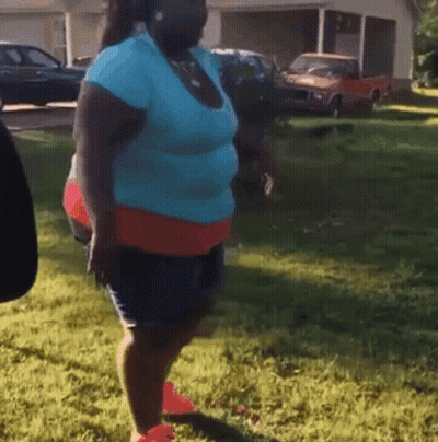 Woman In Blue Shirt And Red Shorts GIF