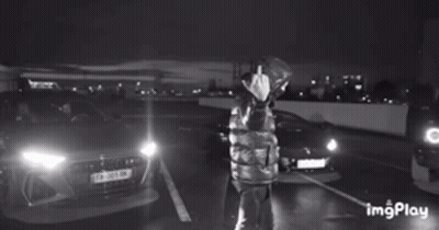 Woman In Blue Shirt Arms In Air Saying Alive & Well GIF