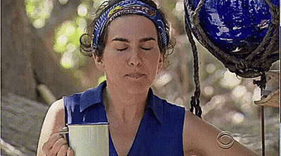 Woman In Blue Shirt Holding Coffee Making Funny Face GIF