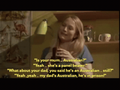 Woman In Blue Shirt Holding Cup Talking To Another Woman GIF