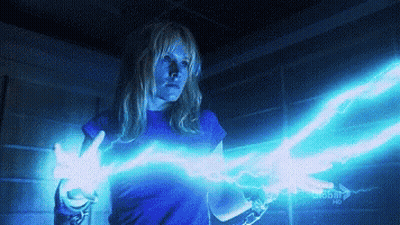 Woman In Blue Shirt Holding Lightning Bolt Next To Global HD Sign GIF