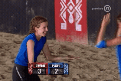 Woman In Blue Shirt In Front Of Prvijera Sign GIF