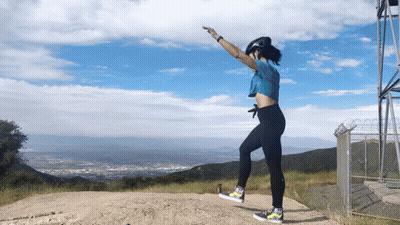 Woman In Blue Shirt Jumping GIF