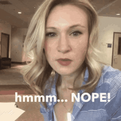Woman In Blue Shirt Making Funny Face GIF