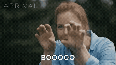 Woman in Blue Shirt Making Funny Face Saying Boooo