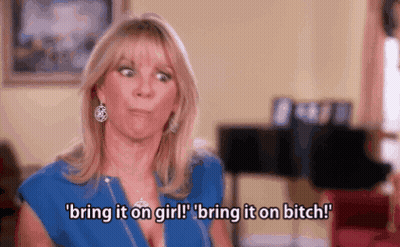 Woman In Blue Shirt Making Funny Face Saying Bring It On Girl Bring It On Bitch GIF