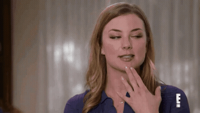 Woman In Blue Shirt Making Funny Face With Hand On Face GIF